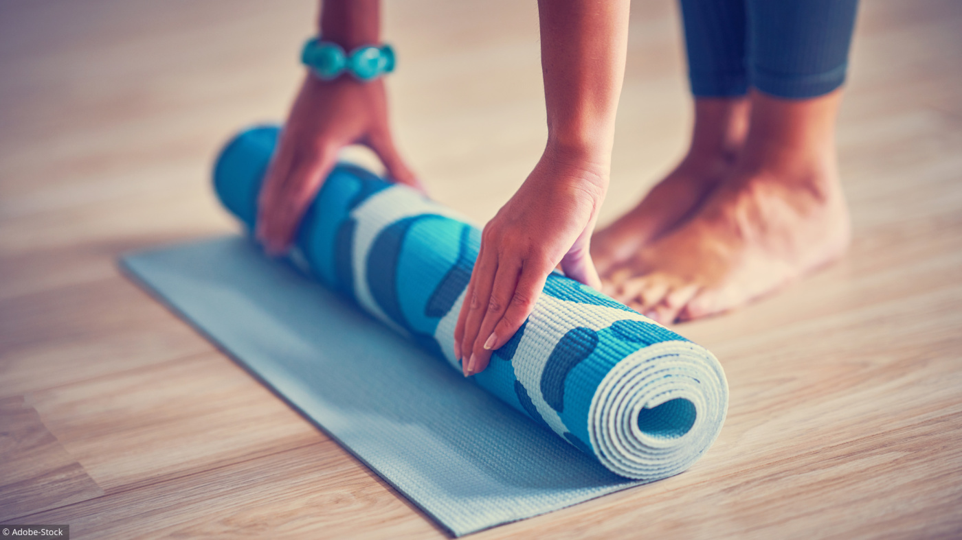 Picture of adult woman practising yoga at home